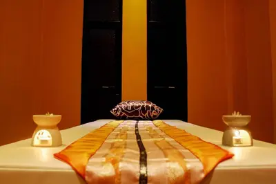 a chair sitting on top of a bed at Lub Sbuy House Hotel - SHA in Phuket Town
