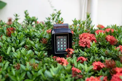 a cell phone sitting in the middle of flowers at Villa Paradise Island in Rawai Beach