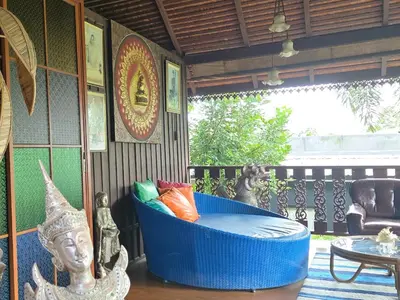 a blue tub sitting on top of a porch at Marin' s Home in Thalang