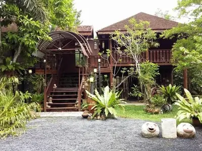 a house with a staircase in front of it at Marin' s Home in Thalang