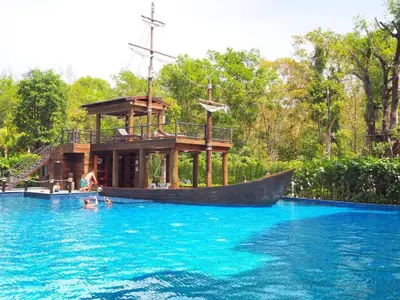 a boat in the water in a swimming pool at Title Residence Naiyang Beach Phuket in Nai Yang Beach