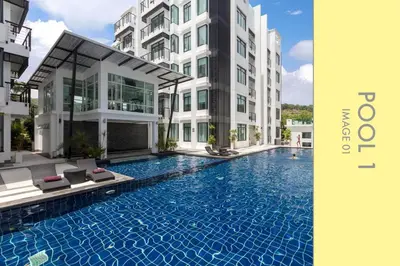 an image of a swimming pool in front of a building at Stylish Condo w. Pool View 2F in Kamala Beach
