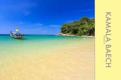 a boat sitting in the water on a beach at Stylish Condo w. Pool View 2F in Kamala Beach