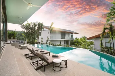 a view of the pool from the balcony of a house at Himmapana Villas - Terraces - SHA Extra Plus in Kamala Beach
