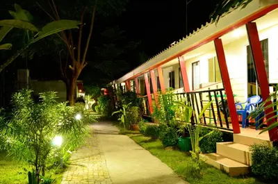 a house at night with a sidewalk and plants at Chongkhao Resort- Phi Phi Island in Phi Phi Don