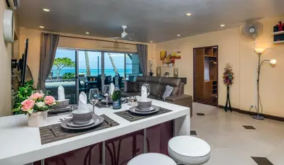 a kitchen and living room with a view of the ocean at Dreambeach 2-villas in Panwa Beach