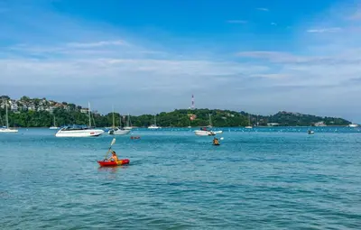 a person in a red boat in a large body of water at Dreambeach 2-villas in Panwa Beach