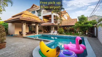 a house with a swimming pool with a bunch of inflatable bananas at Angel Pool Villa Phuket - SHA Extra Plus - indoor Warm pool in Phuket Town