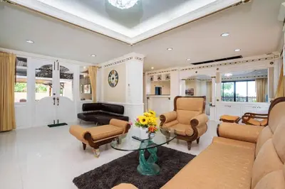 a living room with a couch and chairs and a table at Angel Pool Villa Phuket - SHA Extra Plus - indoor Warm pool in Phuket Town