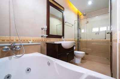 a bathroom with a tub and a toilet and a sink at Angel Pool Villa Phuket - SHA Extra Plus - indoor Warm pool in Phuket Town