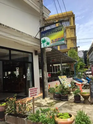 a building with a sign for a garden market at Garden Phuket Hotel in Patong Beach