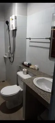 a bathroom with a toilet and a sink at Kata Happy Place in Kata Beach