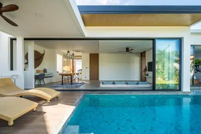 an open living room and swimming pool in a villa at Cocoon Villa - Peaceful private pool villa in north Phuket in Phuket Town