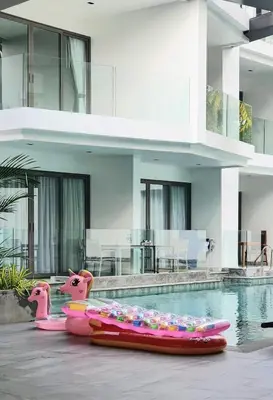 a swimming pool with inflatables in a house at CYAN Resort Kamala Beach Apartments Condominiums in Kamala Beach