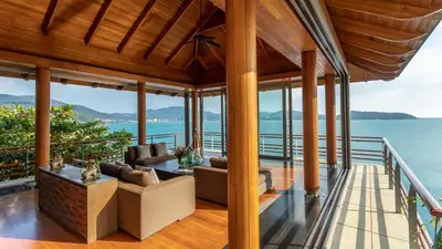 a living room with a view of the ocean at Villa Chelay in Kamala Beach