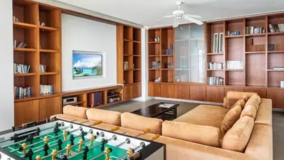 a living room with a ping pong table at Villa Chelay in Kamala Beach