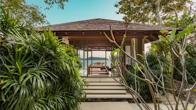a resort with a pathway leading to the front of the house at Villa Chelay in Kamala Beach