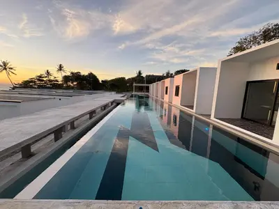 a swimming pool on the roof of a building at Pine Bungalow Krabi in Klong Muang Beach