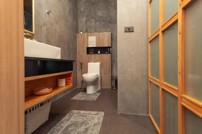 a bathroom with a toilet and a sink at Cozy design studio near Nai Harn beach in Nai Harn Beach