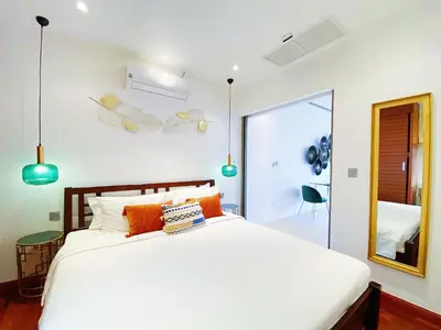a bedroom with a large white bed and a mirror at Beautiful 1br Plunge Pool Villa Walk To Bangtao Beach in Ban Thalat Choeng Thale