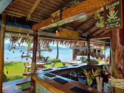 a bar with a view of the ocean at Lam Sai village hotel Koh Yao Noi in Ko Yao Noi