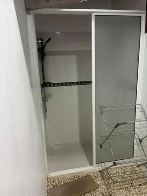 a shower with a glass door in a bathroom at Vivi Boutique Room Hotel SHA Plus in Rawai Beach