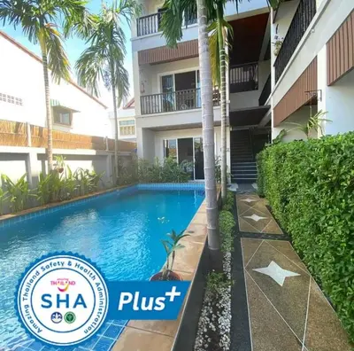 a swimming pool in front of a building at Vivi Boutique Room Hotel SHA Plus in Rawai Beach