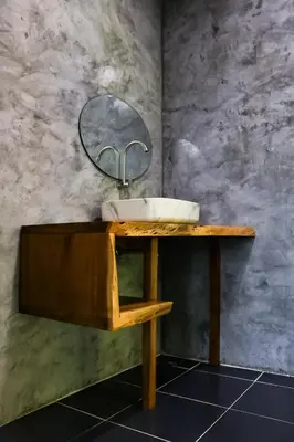 a bathroom with a sink and a mirror on a counter at Annie Meen's place Koh Yao Noi in Ko Yao Noi