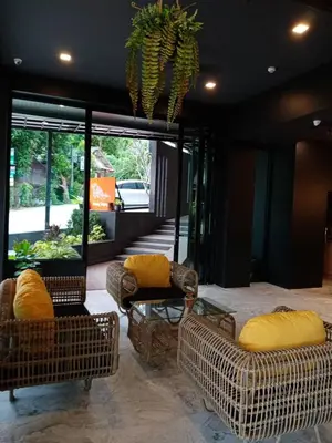 a living room with two chairs and a table at Aonang Dugong-SHA Extra Plus in Ao Nang Beach