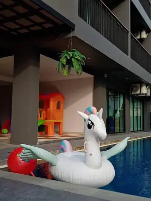 a unicorn float in the middle of a pool at Aonang Dugong-SHA Extra Plus in Ao Nang Beach