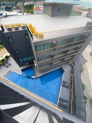an overhead view of a building with a swimming pool at Aonang Dugong-SHA Extra Plus in Ao Nang Beach
