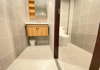 a bathroom with a toilet and a sink at The Nakara Town in Ban Rangeng