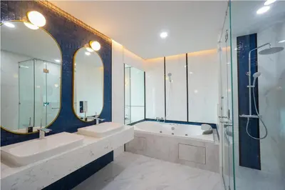 a bathroom with two sinks and a tub and a shower at Poolrada Boutique Hotel - SHA Plus in Thalang