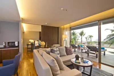 a living room with a couch and a table at Le Coral Resort in Natai Beach