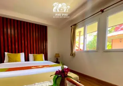 a bedroom with a bed and a window at Phi Phi Ba Kao Bay Resort in Phi Phi Don
