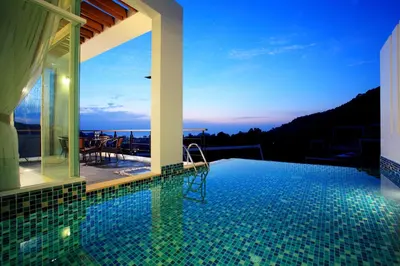a swimming pool in a house with a view at Kata Sea View Villas in Kata Beach