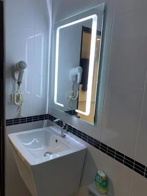 a bathroom with a sink and a mirror at Beverly Hills Villa Patong in Patong Beach