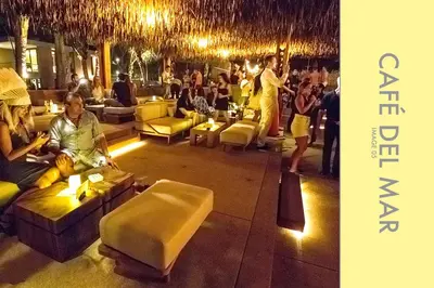 a group of people sitting in a room at Pool Access 2 BDR Stylish Condo in Kamala Beach