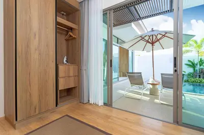 an open living room with a view of the ocean at Shambhala Grand Villa - Private Pool Villas by Escape Villas - Top Choice - Guest Favorite - Best Location in Bang Tao Beach