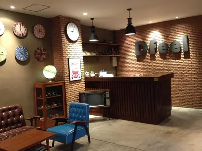 a store with clocks on the wall and a tv at Dfeel House in Patong Beach