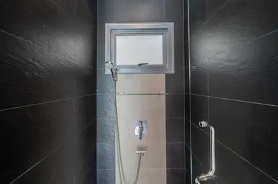 a shower with a window and a glass door at Relax & Enjoy Stay! Elegant 3BR Pool Villa Talosy in Rawai Beach