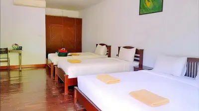 a room with three beds with white sheets at Doo Dee Boutique Resort by Swiss Chalet in Ao Nang Beach