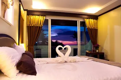 a bedroom with a bed with a heart on it at Baan Sailom Hotel Phuket - Sha Extra Plus in Karon Beach