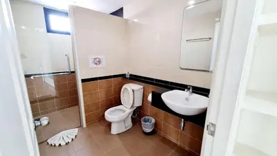 a bathroom with a toilet and a sink at TP House at town in Phuket Town