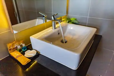 a white sink in a bathroom with a mirror at Honeybee Pool Villa Smooth as Silk in Ao Nang Beach