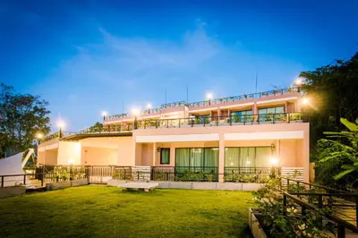 a building with a lawn in front of it at Studio apartments on a hill in Kathu