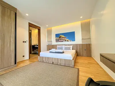 a bedroom with a large bed in a room at SHAMBHALA GRAND Pool Villas x MonthStayZ Thailand in Phuket Town