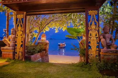 a door to a house with a view of the water at Royal Thai Villa Phuket - SHA Extra Plus in Rawai Beach