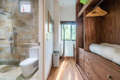 a bathroom with a toilet and a sink and a shower at Villa Stan in Kamala Beach