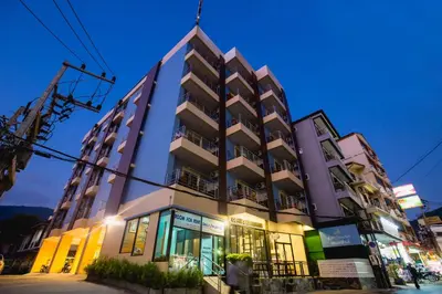 a tall building with a lot of windows at Aim House in Patong Beach